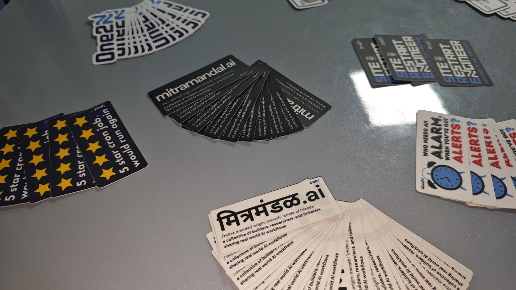 mitramandal.ai branded stickers and swag at Episode 4