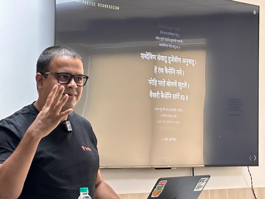 Episode 4 speaker presenting with Marathi poetry on screen